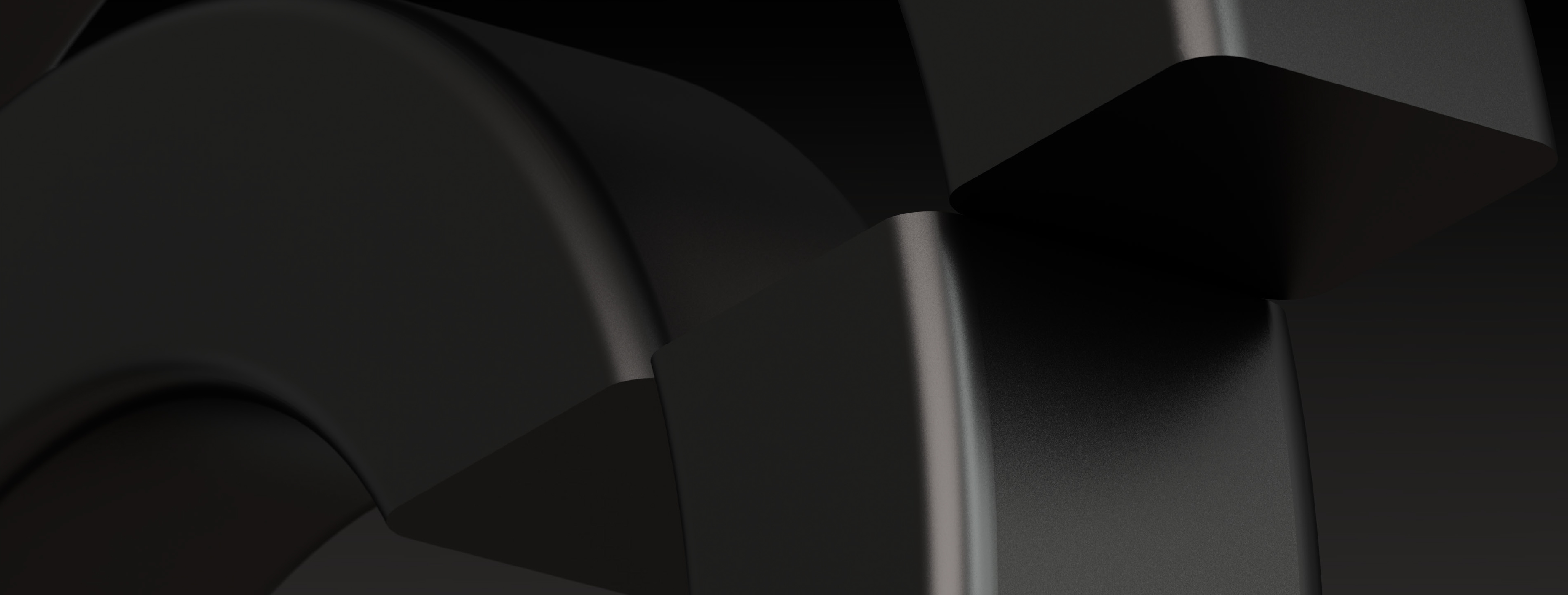 Abstract close-up of overlapping black geometric shapes with smooth curved surfaces and subtle highlights.